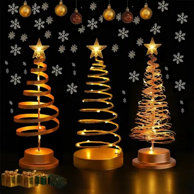 Três árvores de Natal em espiral douradas e acobreadas com luzes de LED e estrela no topo sobre fundo escuro