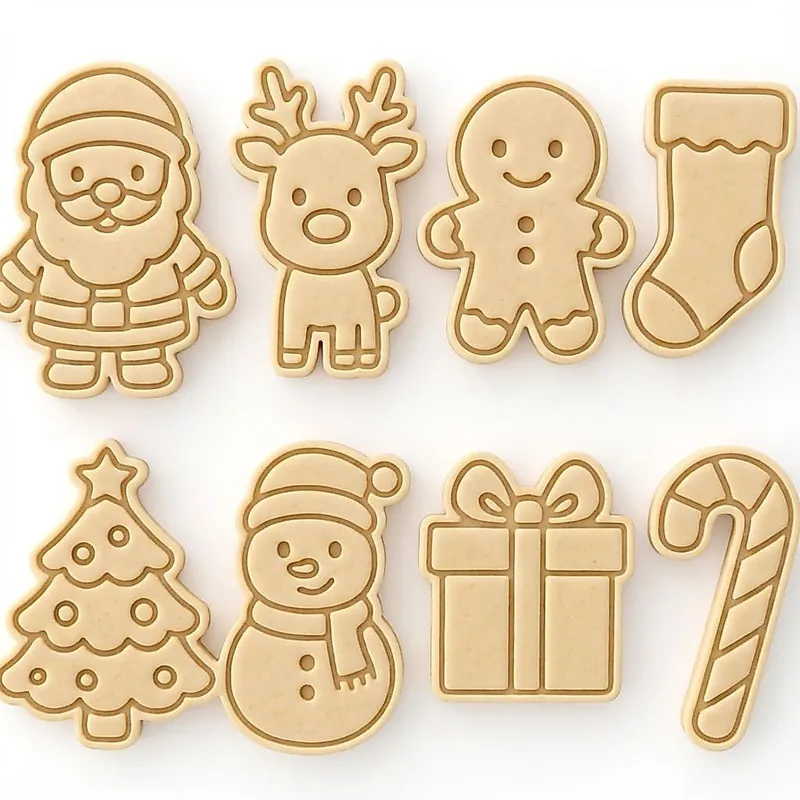 Oito biscoitos claros com desenhos natalinos marcados: Papai Noel, rena, boneco de neve, árvore, meia e outros