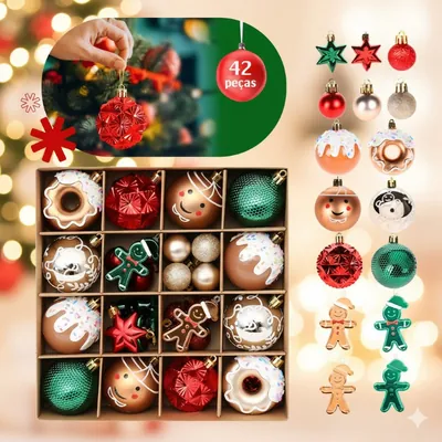 Caixa com enfeites de Natal: bolas vermelhas e verdes, rosquinhas com glacê, estrelas e bonecos de gengibre