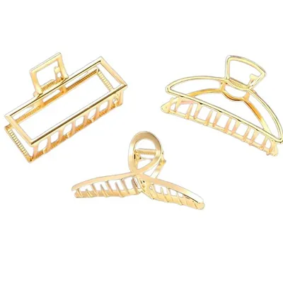 Três piranhas de cabelo de metal dourado vazado: modelo retangular, meia-lua e laço cruzado, sobre fundo branco